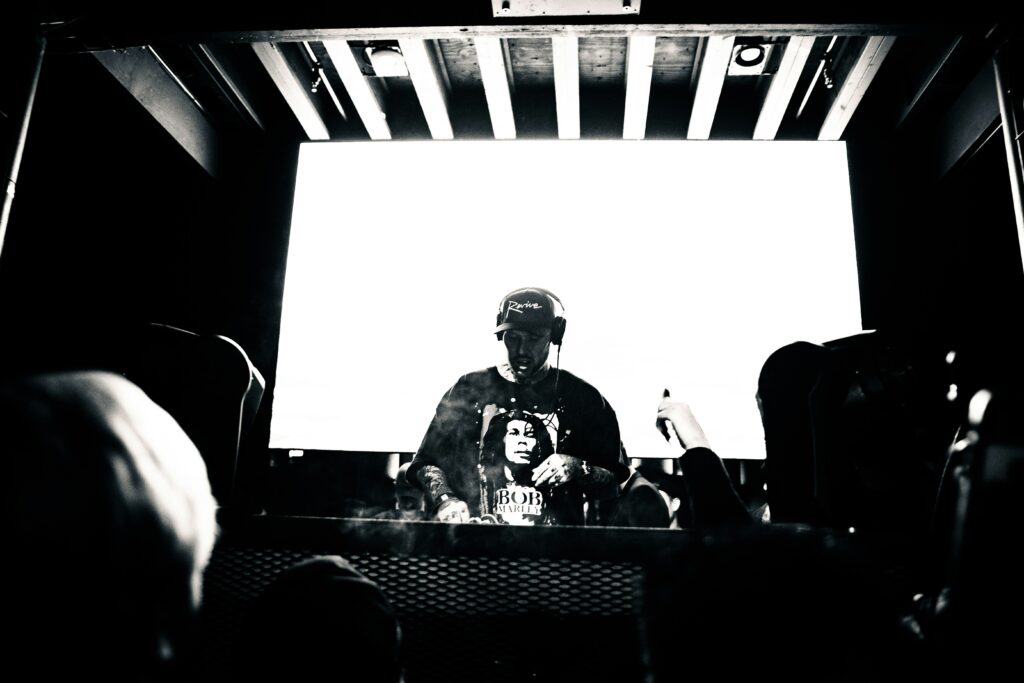 The DJ is playing music in the club