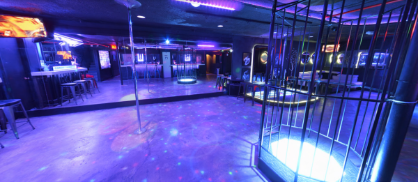 Dancing pole in the club with cage