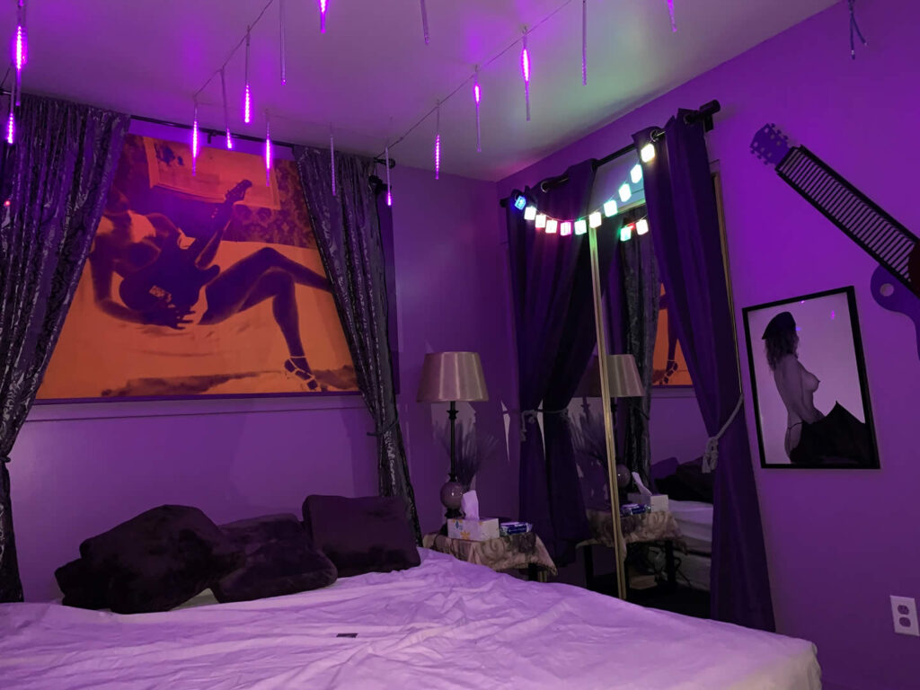 Big bedroom in the club with frames in the wall