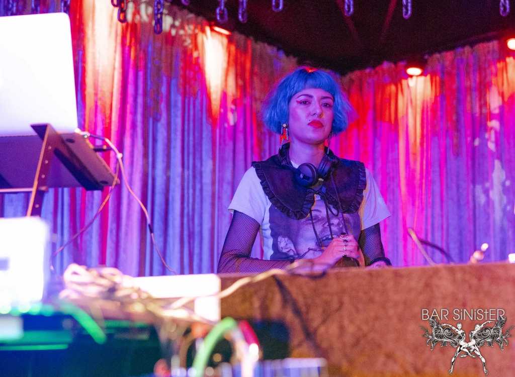 DJ is playing music in the club