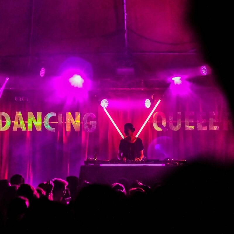 DJ is playing music in the stage