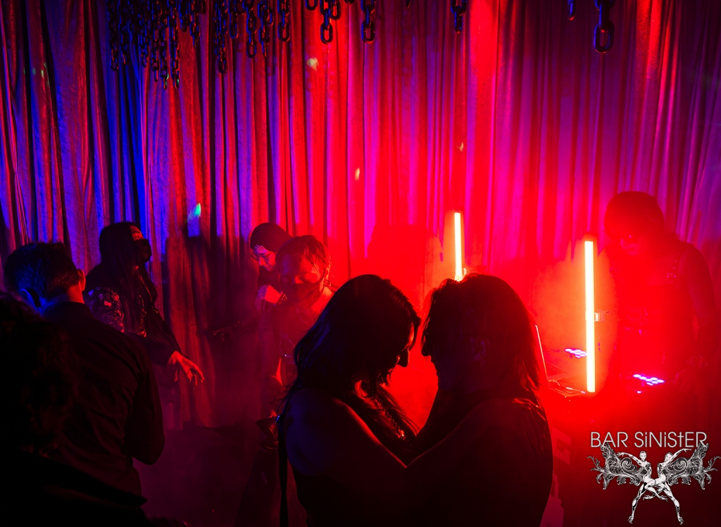 man and woman dancing in the club