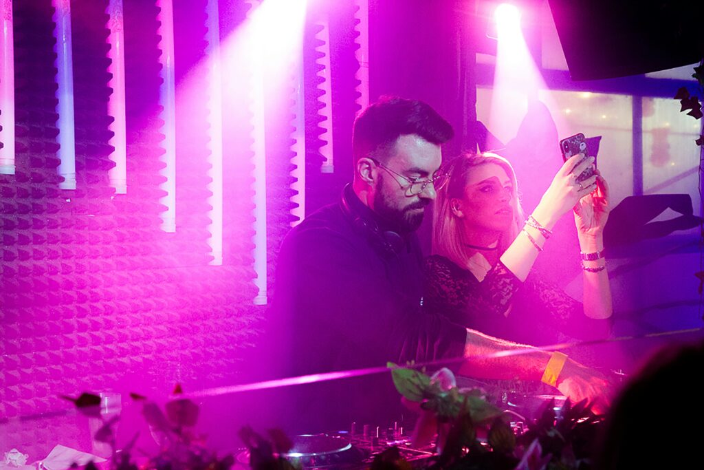 DJ and woman in the stage playing music