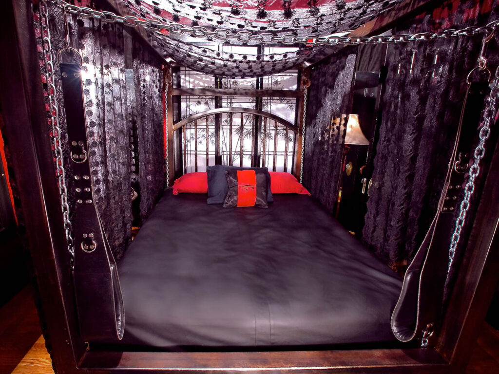 Big bed frame with chains on the side