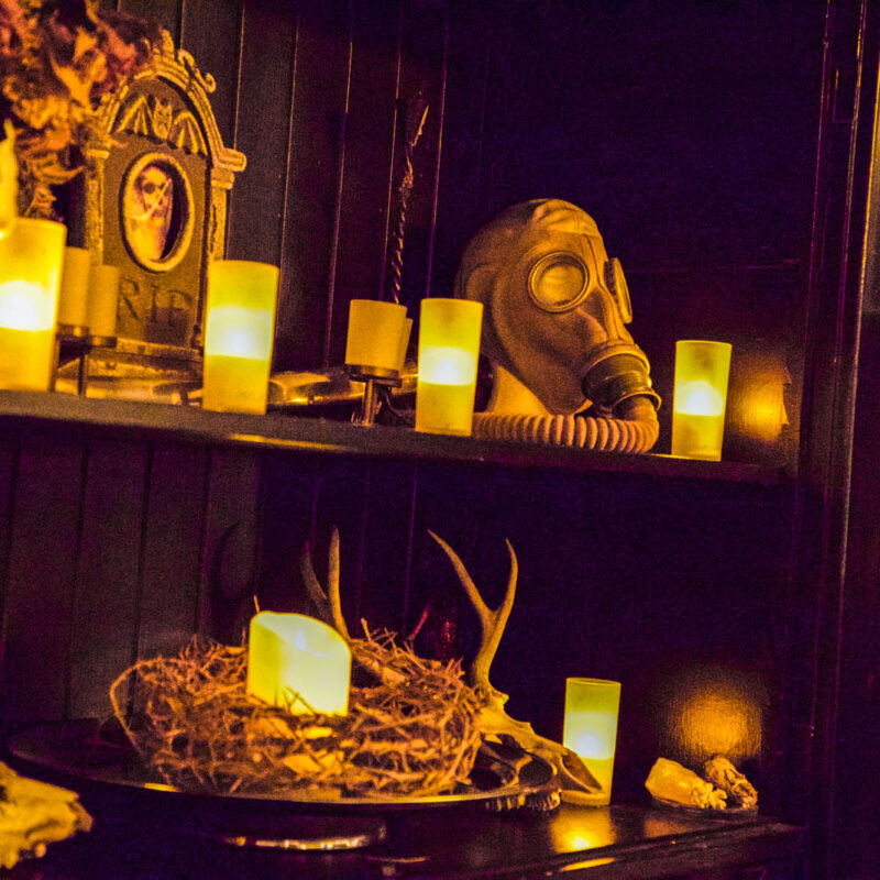 Candles and mask in the table