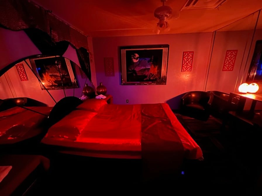 Bedroom with frames in the wall