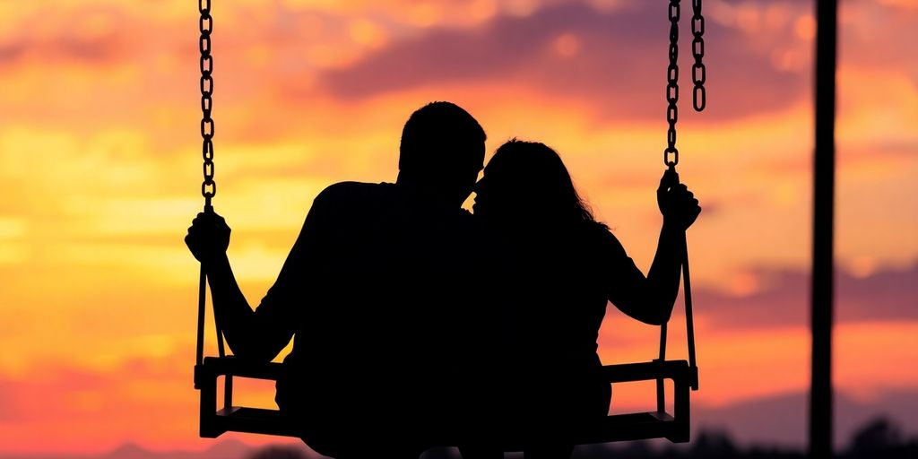 Two people swinging together, sunset background.