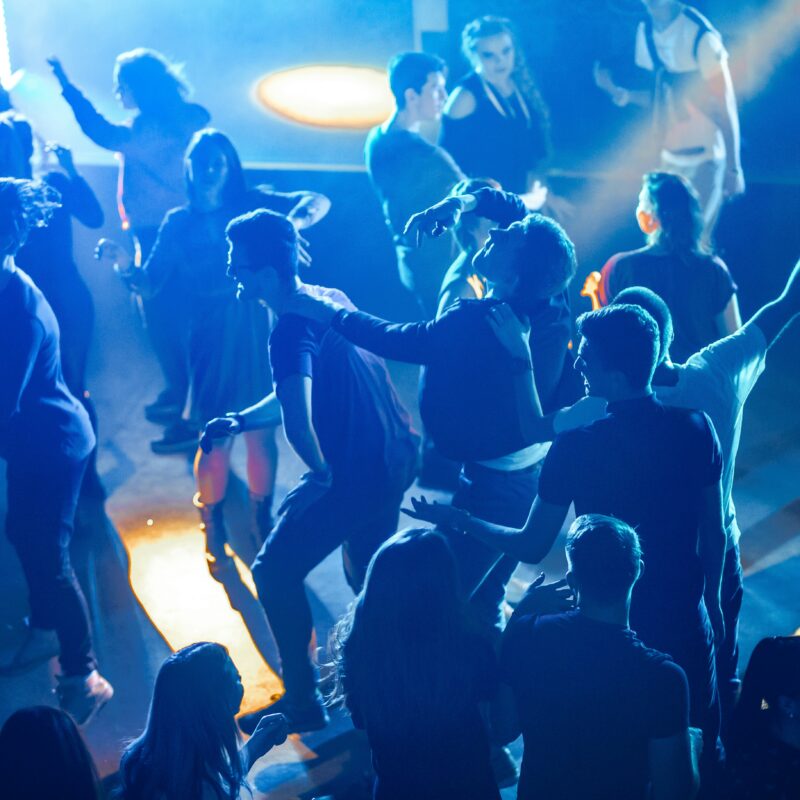 Man and woman dancing in the crowd