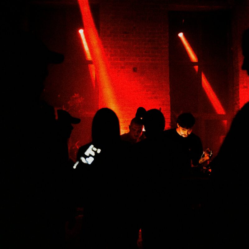 People in the dark standing