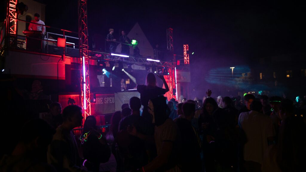 a group of people standing on top of a stage