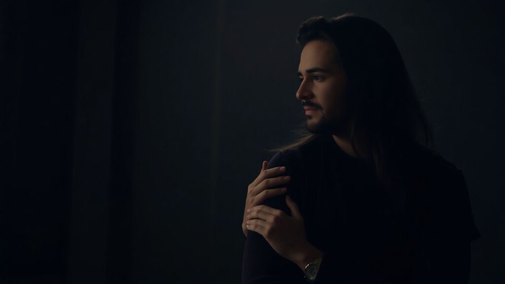 Couple respecting personal space in a bedroom.