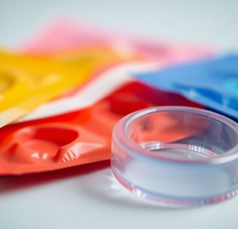 Various safer sex tools including condoms and dental dams.