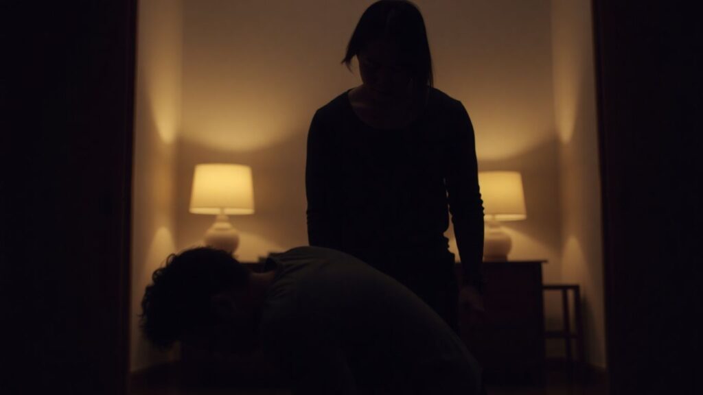 Couple in a power dynamic, one kneeling, the other standing.