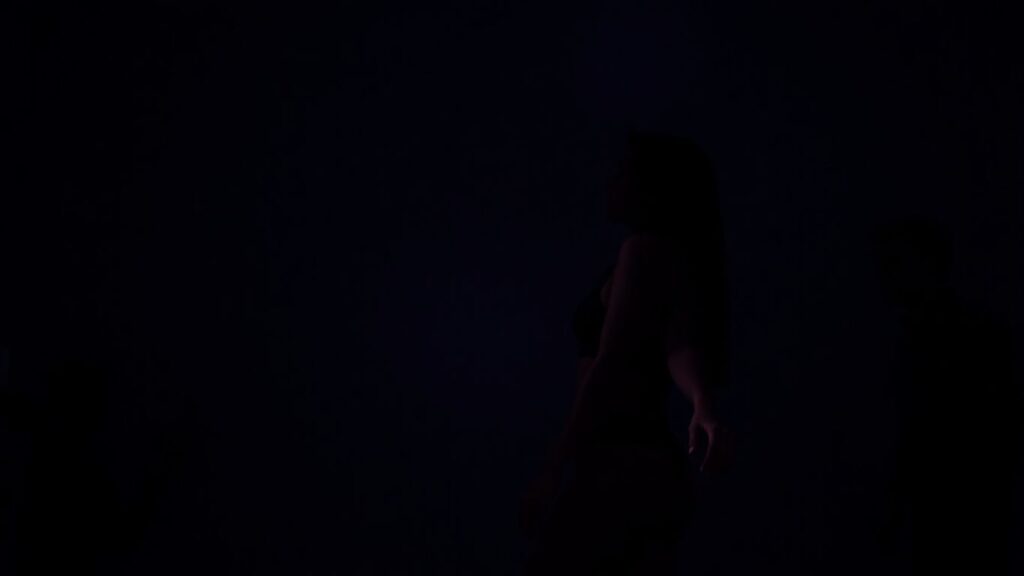 Couple in intimate bedroom, exploring consensual power dynamics.