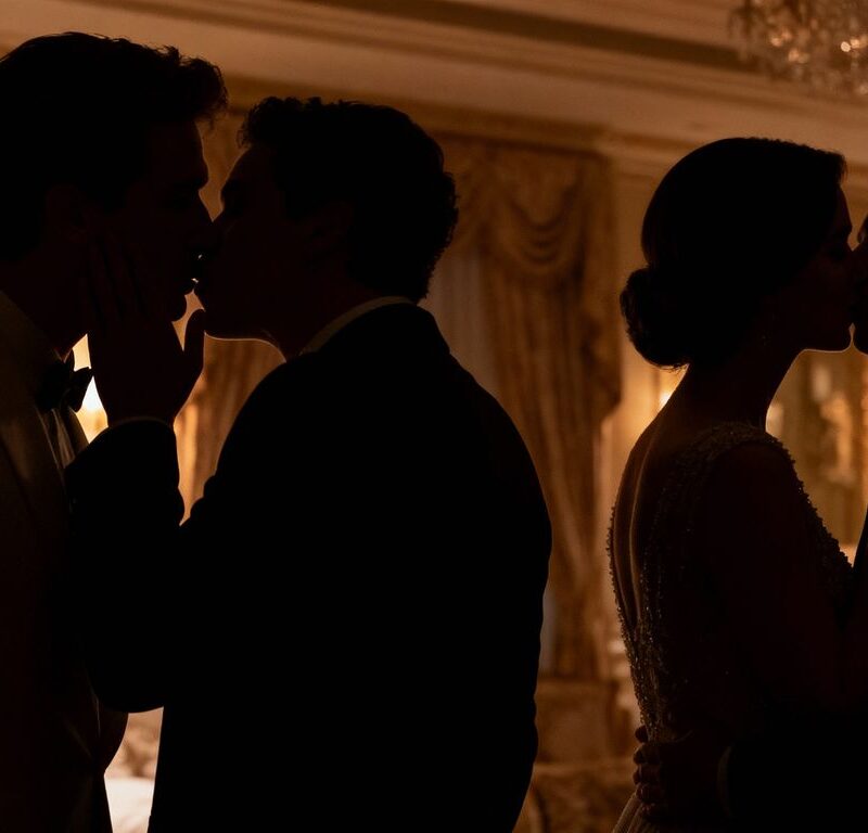 Couples in silhouette sharing secrets in a dimly lit room.