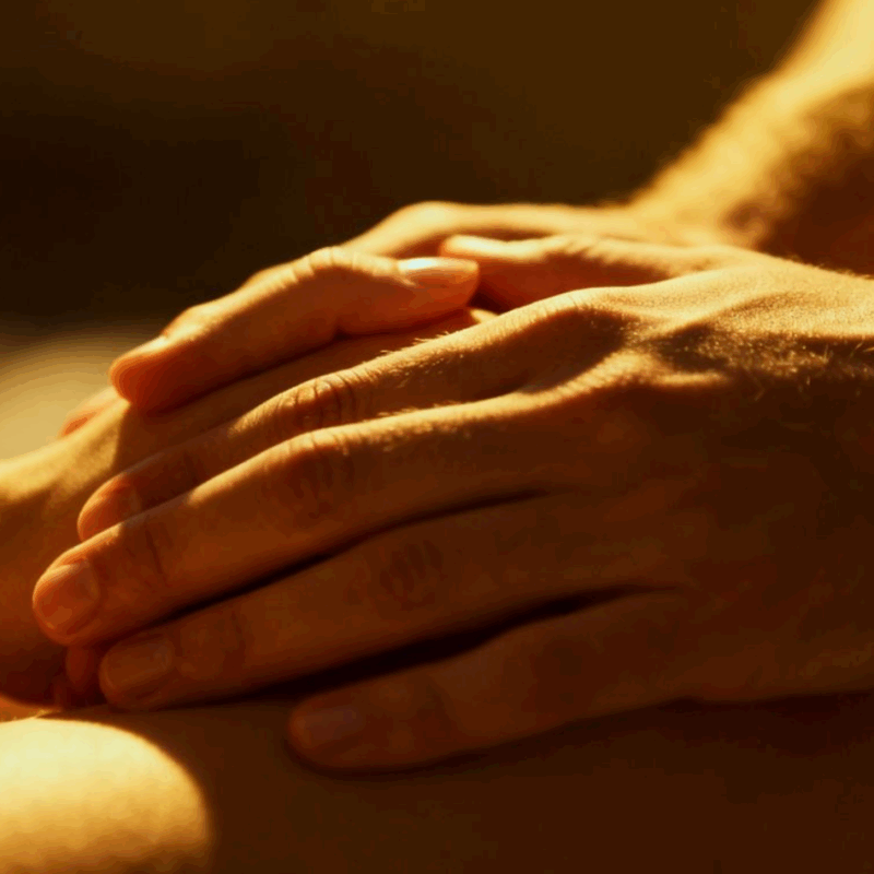 Couple's hands exploring each other intimately.