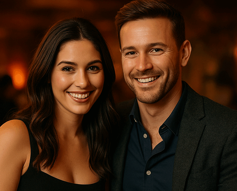 A well-dressed couple sitting closely together in a warmly lit Chicago lounge