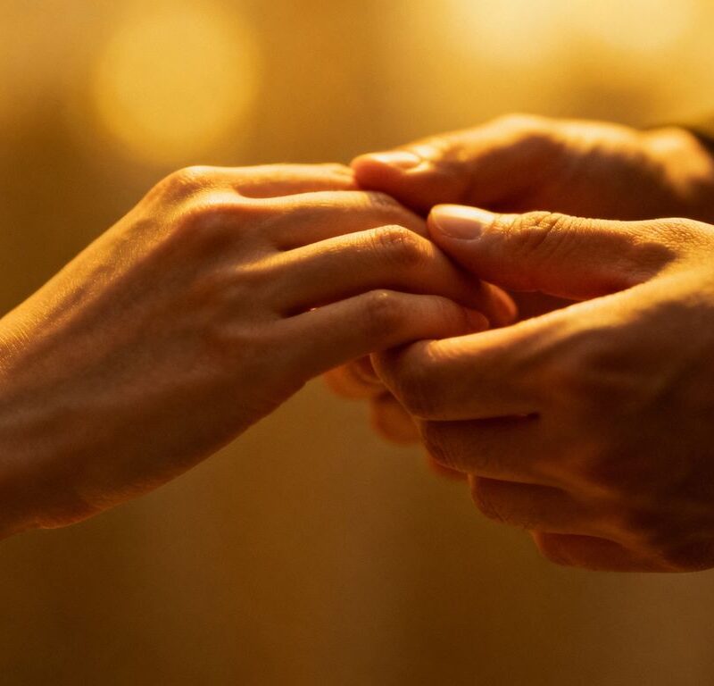 Hands touching intimately