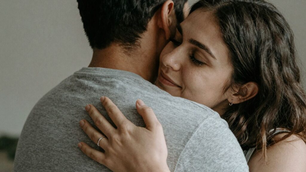 Couple embracing, showing emotional support and intimacy.