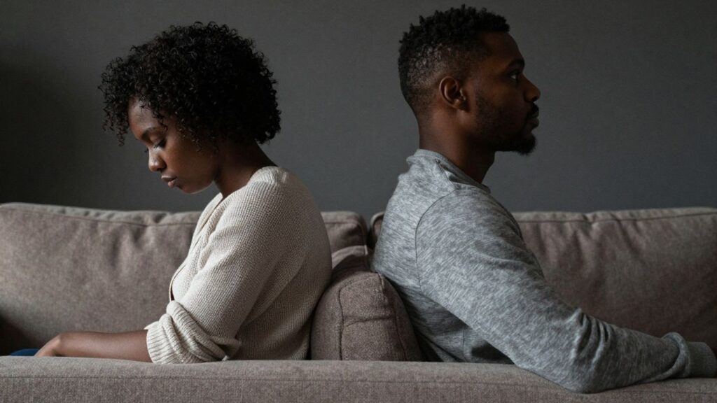 Couple with backs turned, showing emotional distance.