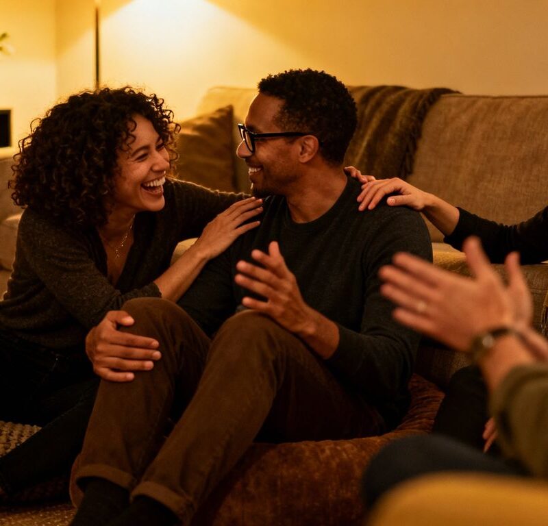 People in a relaxed, intimate setting discussing relationships.