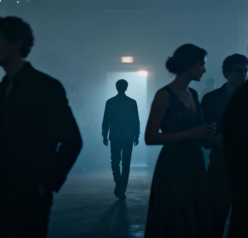 Person walking away from a party.