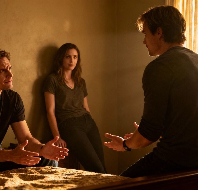 Three people in a bedroom, complex emotions in a threesome.