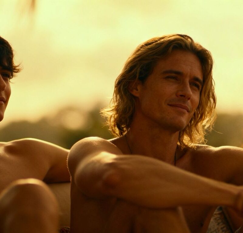 Three people in a comfortable, intimate setting.