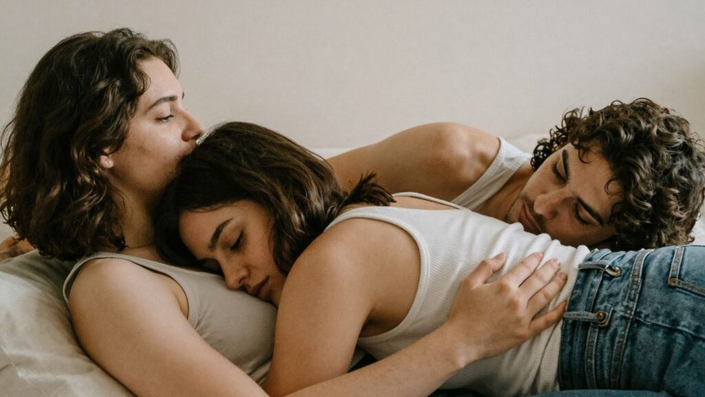Three people in a safe and intimate embrace.