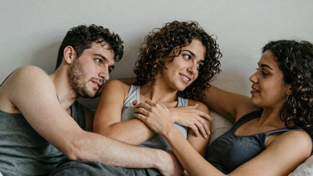 Three people in an intimate, comfortable setting.