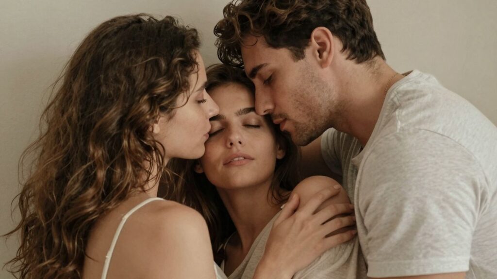 Three people in an intimate, comfortable setting.