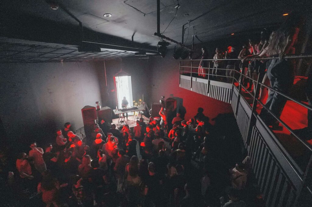 a group of people in red uniforms on a stage