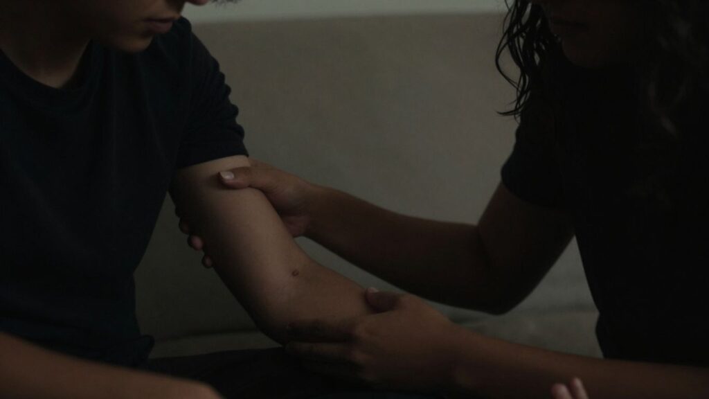 Couple discussing boundaries in a private setting.