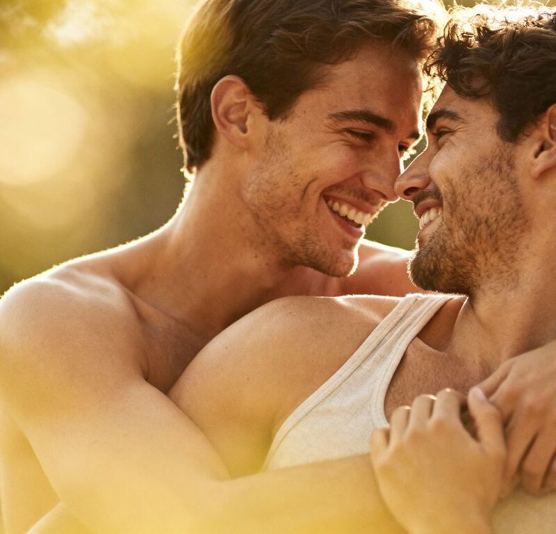 Couple in intimate, comfortable embrace.