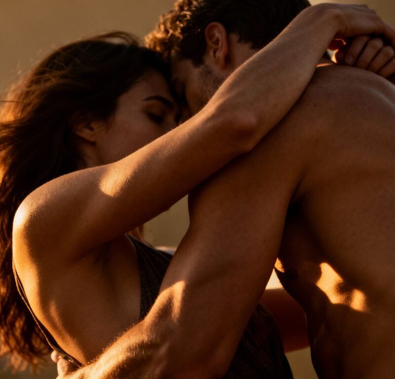 Couple in intimate, dynamic pose during swinging.