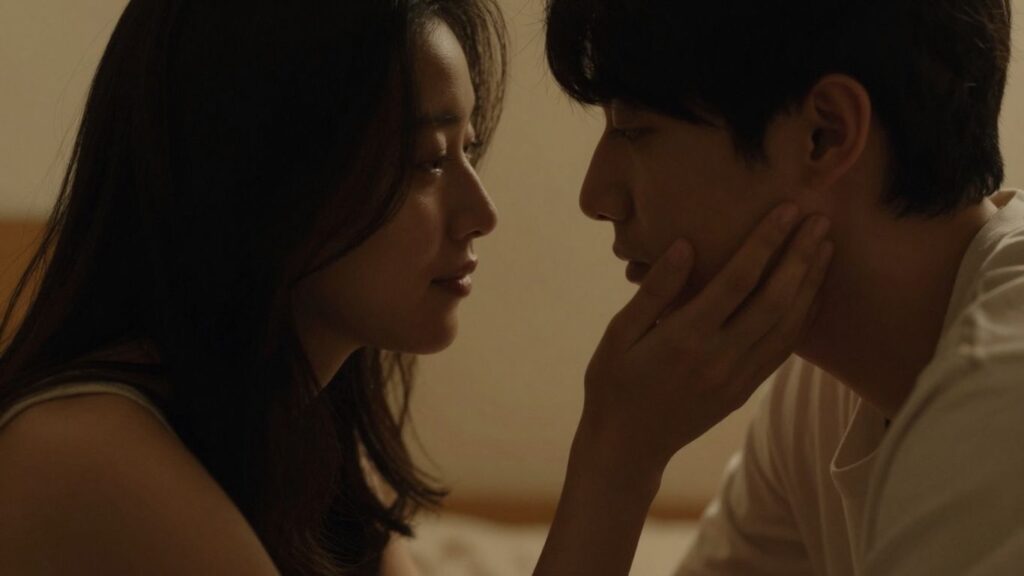 Couple leaning in close, intimate atmosphere