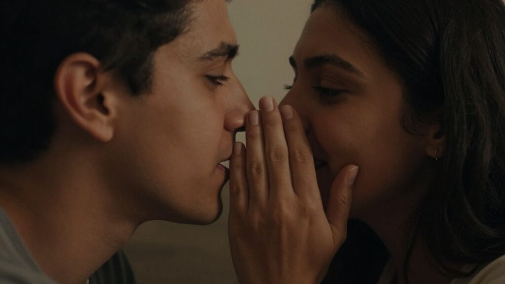 Couple whispering intimately, conveying comfort and connection.