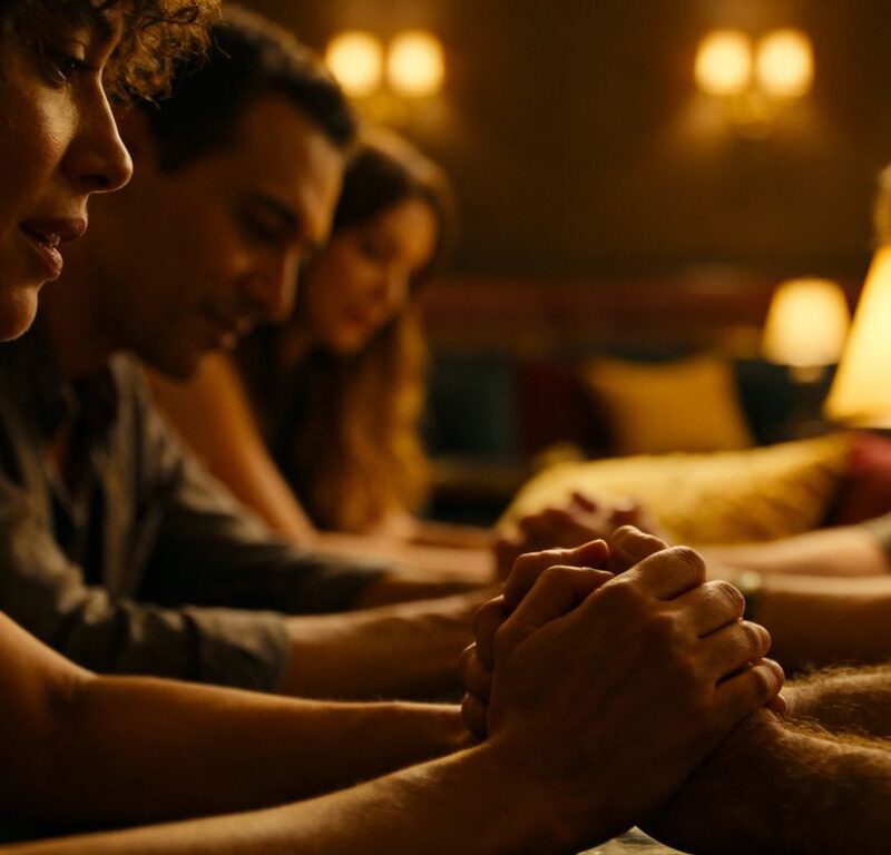 Group of adults in intimate, consensual setting.