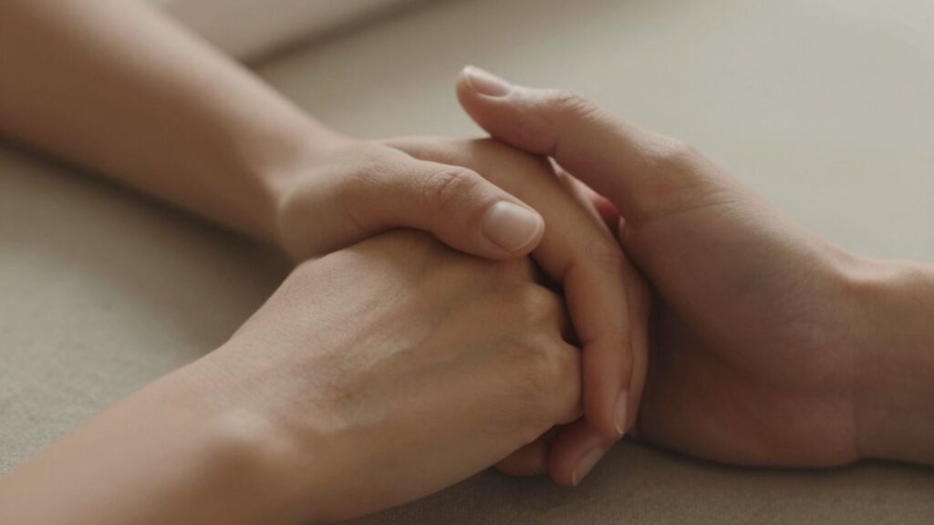 Hands touching intimately, conveying connection and trust.