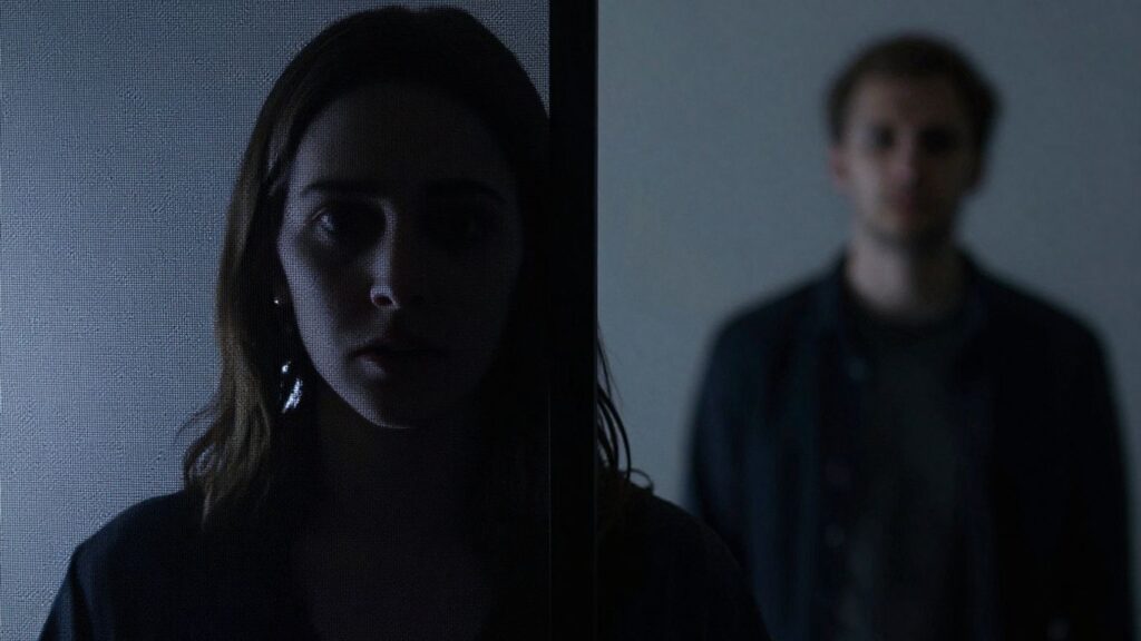 Hesitant connection, digital screen obscuring person, emotional distance.