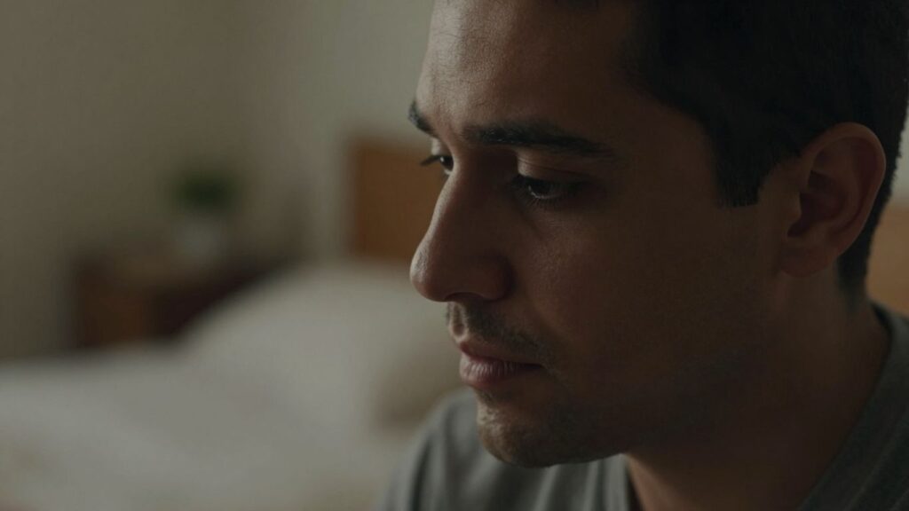 Man's thoughtful face in intimate setting
