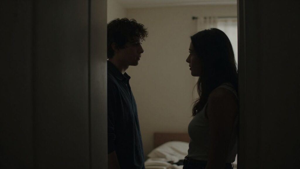 Silhouetted figures in a dimly lit room suggesting privacy.