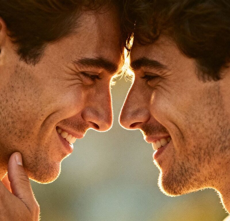 Two men embracing, showing trust and emotional connection.