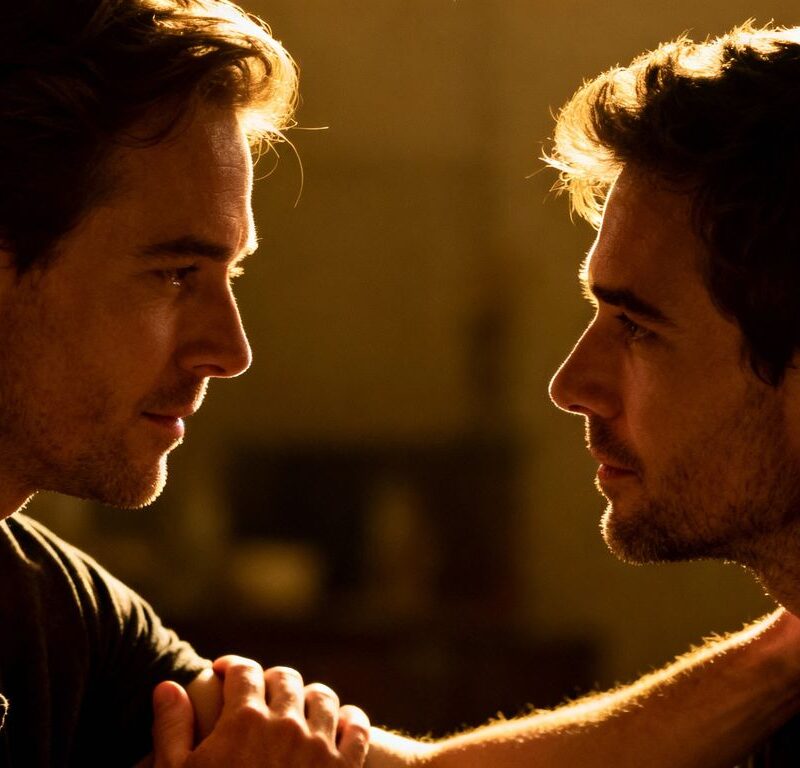 Two men sharing an intimate, respectful moment.