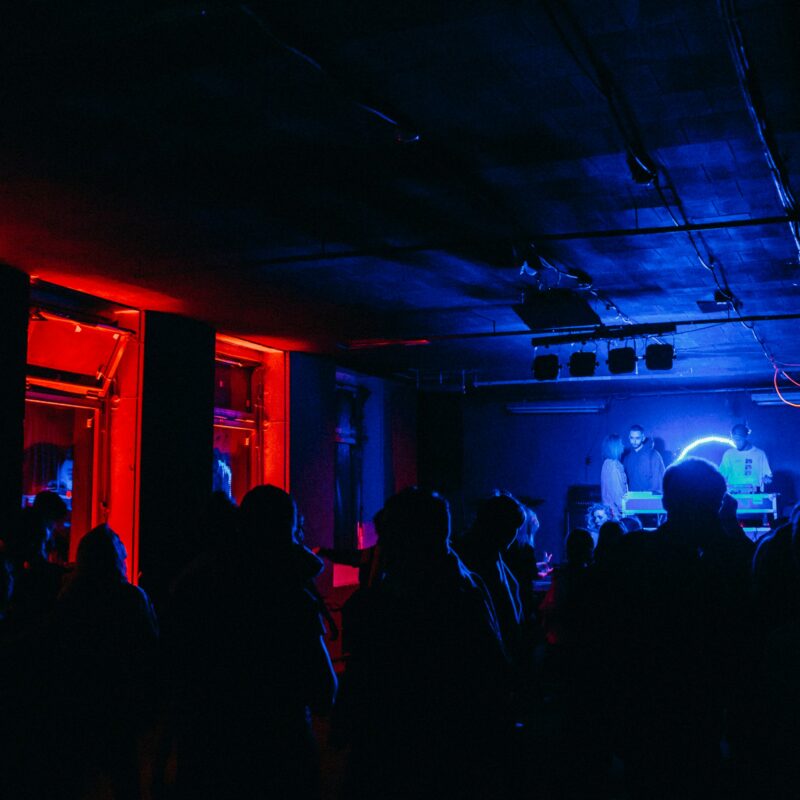 group of people in dim room