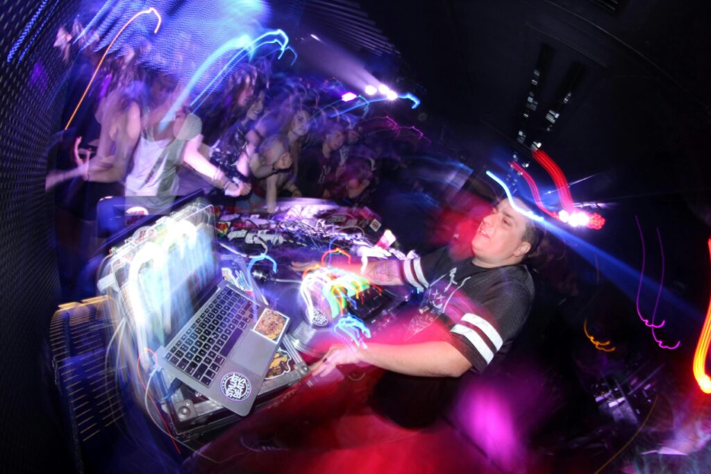 woman in black and white long sleeve shirt sitting on chair