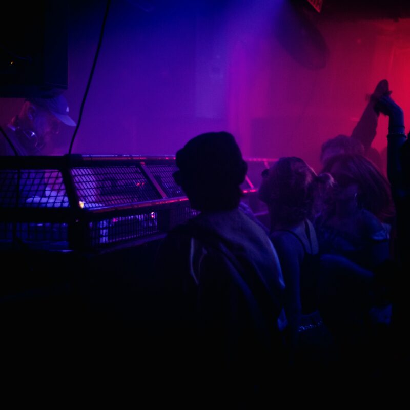 a group of people in a dark room