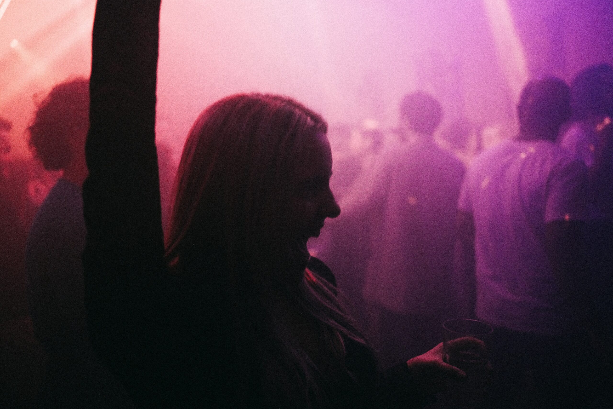 a woman standing in-front of a crowd of people